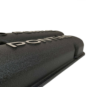 ansen valve covers, pontiac, raised letter logo, black powder coat, close up view
